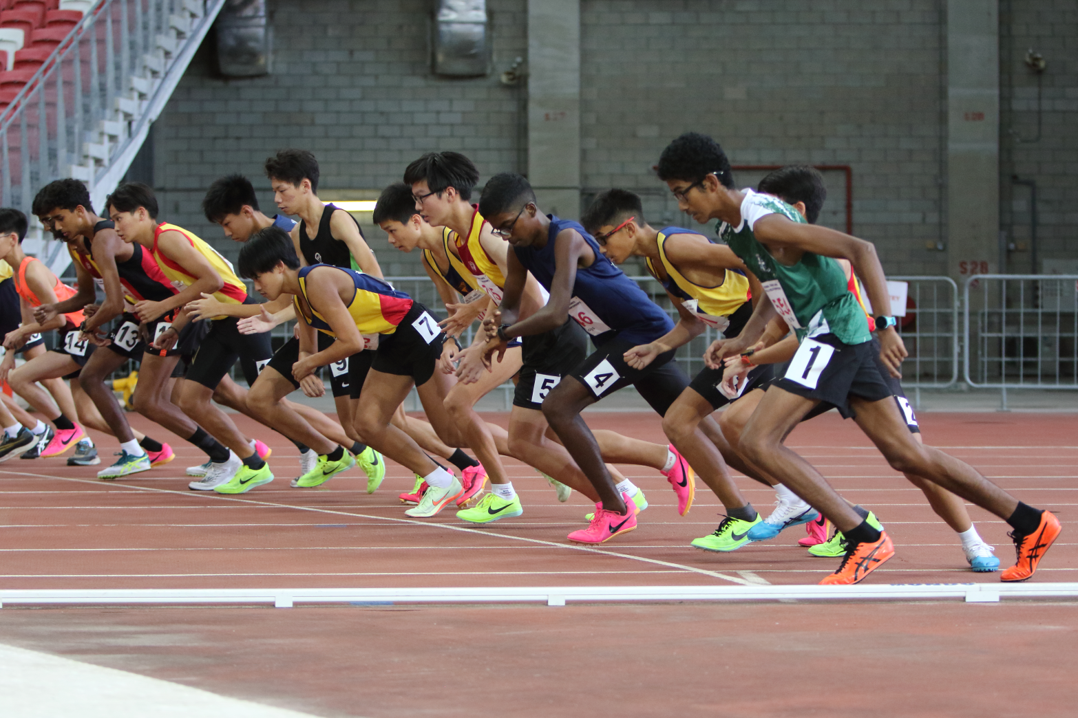 A group of runners mid sprint